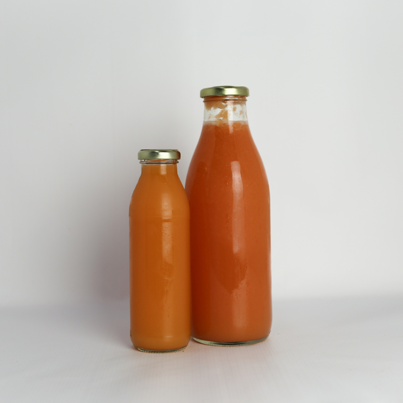 Cold-pressed 100% Ruby Grapefruit Juice in a glass bottle